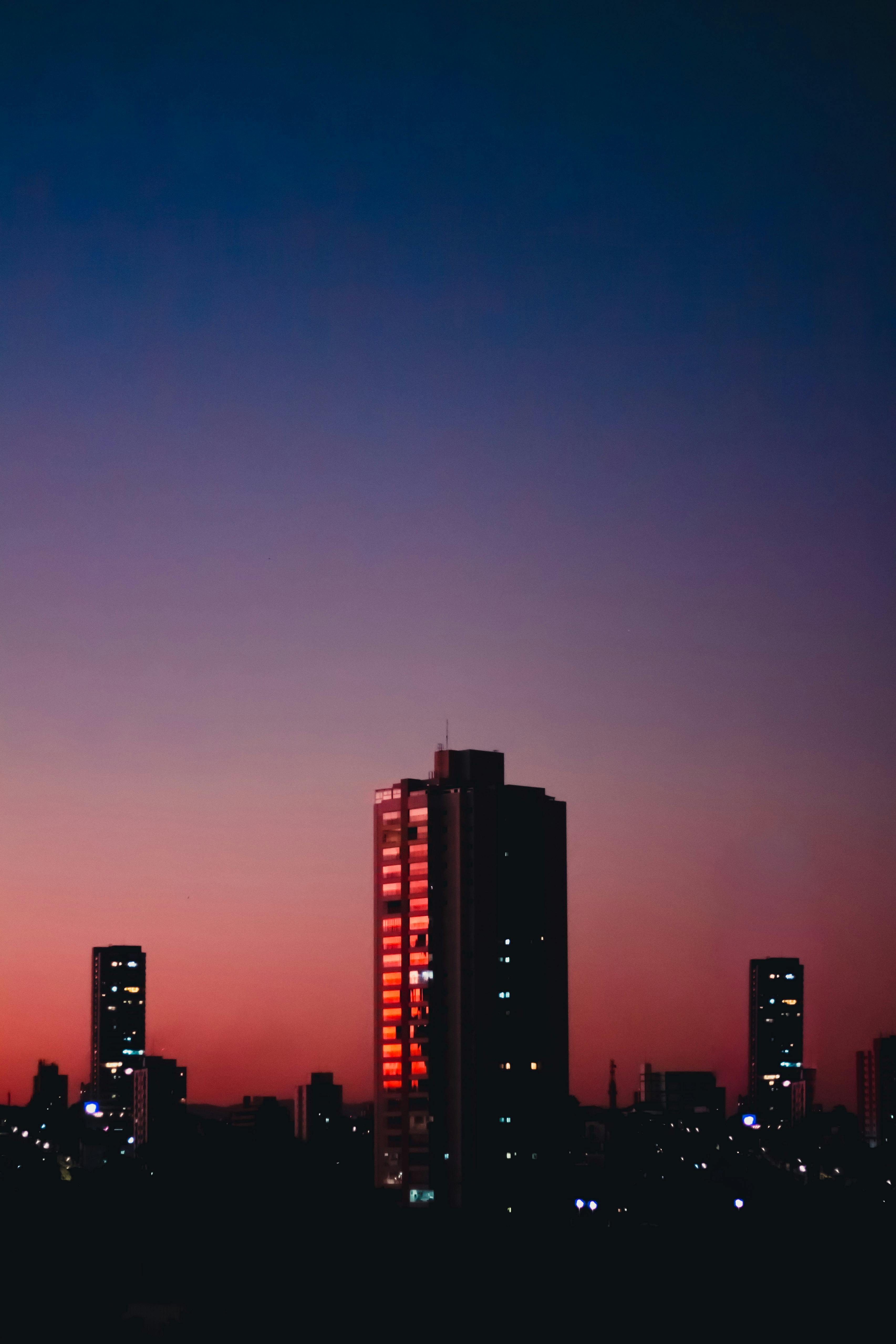 Stunning São Paulo skyline during twilight with colorful evening sky and illuminated skyscrapers.