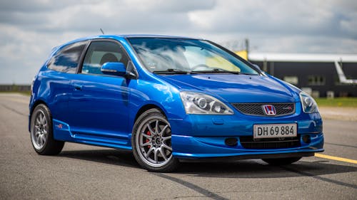 Blue Honda Civic LX Sedan on Empty Parking Lot