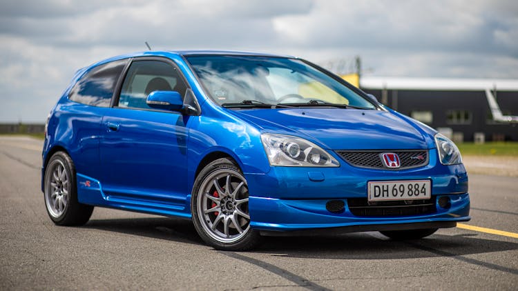 Blue Honda Civic LX Sedan On Empty Parking Lot