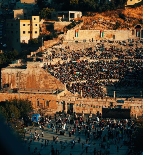Free Thousands gather at the iconic Roman Amphitheatre in Amman, Jordan for a cultural event. Stock Photo