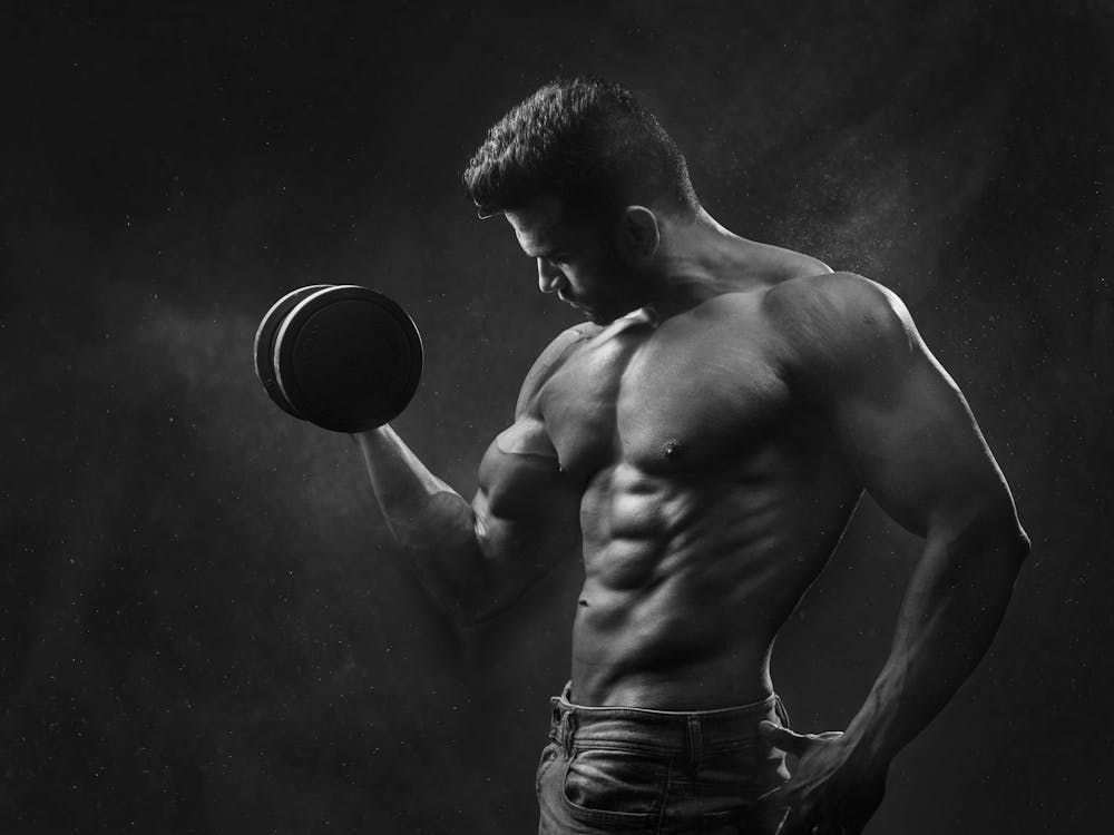 Free Man Holding Black Dumbbell Stock Photo