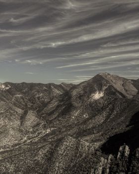 Sweeping view of the rugged mountain terrain in Coahuila, Mexico under dramatic skies.