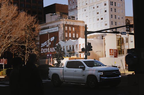 White Chevrolet Silverado Pickup Truck Parked on Street Sidewalk