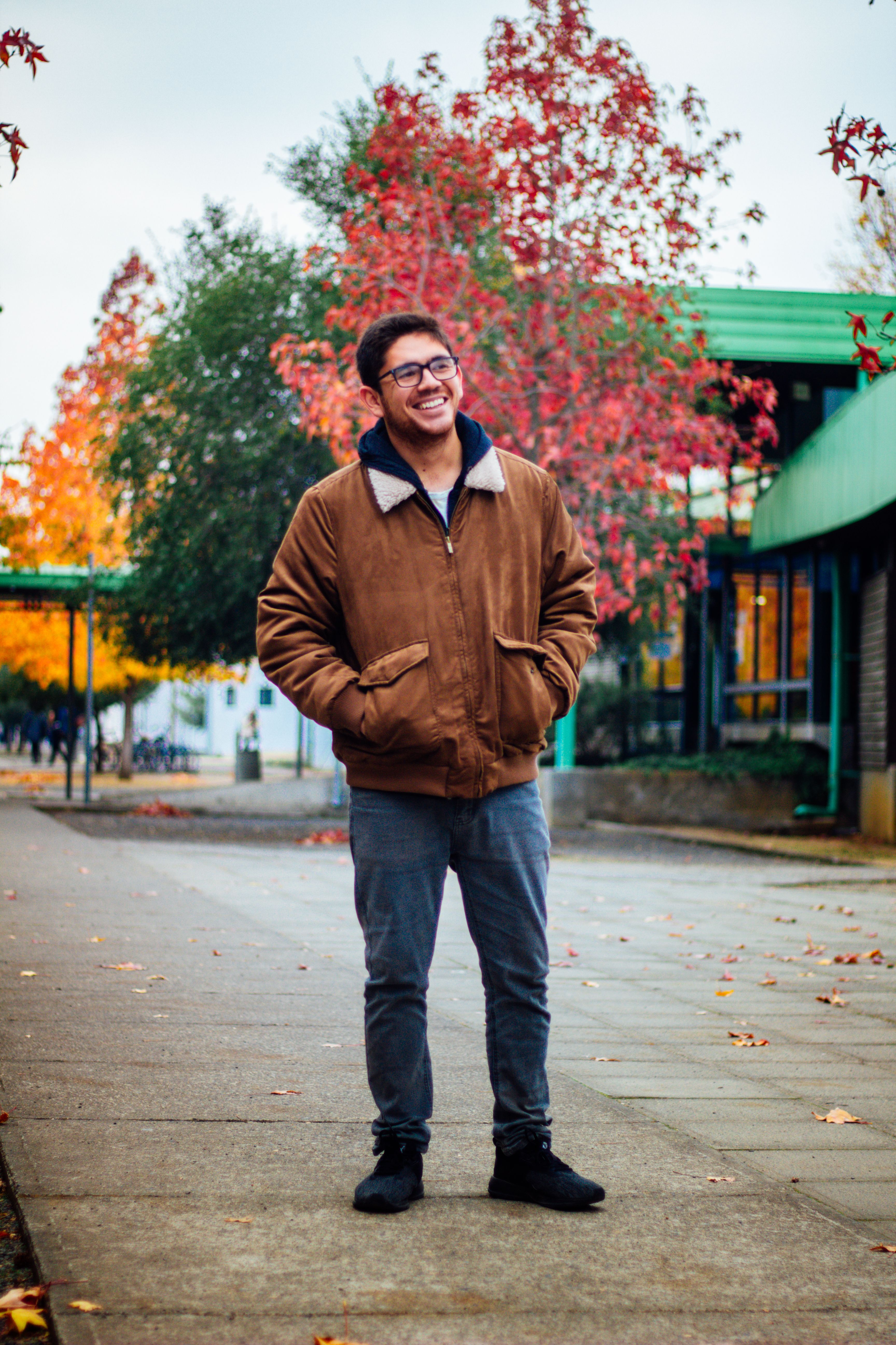 A Man in Brown Jacket Standing on the Street · Free Stock Photo