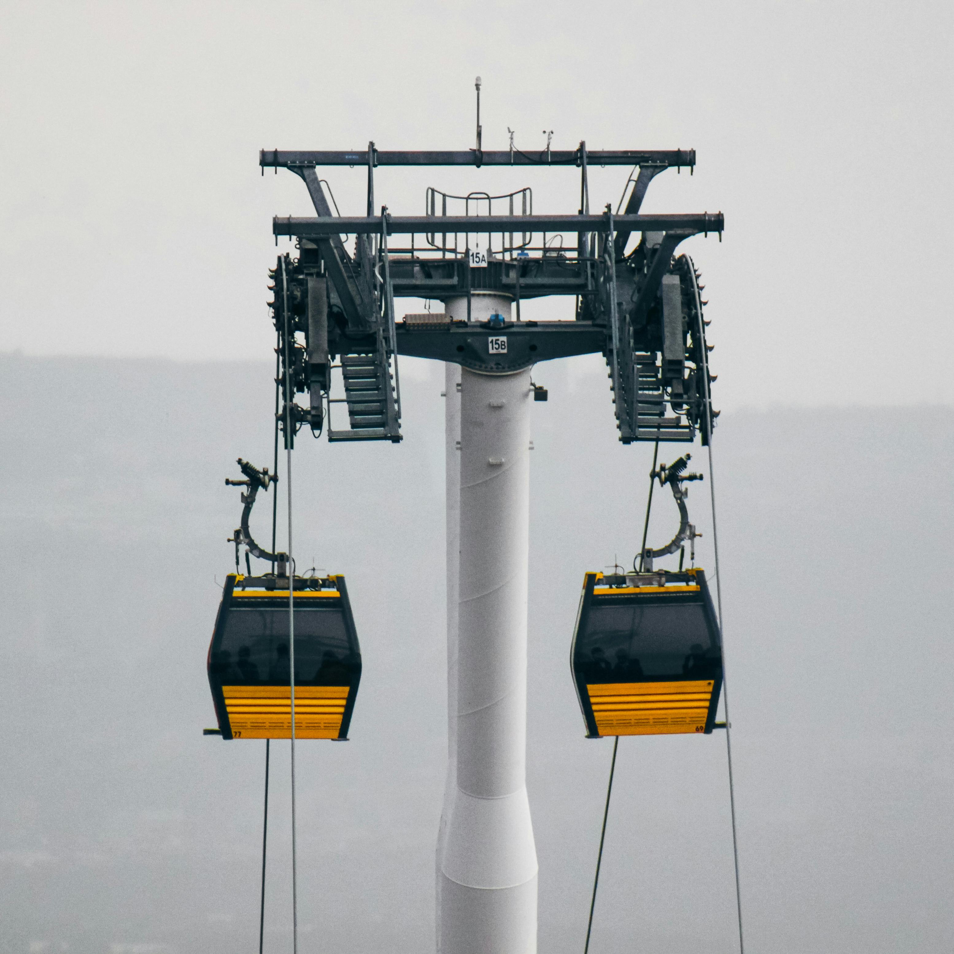 Prescription Goggle Inserts - A cable car system with gondolas in a foggy outdoor setting, showcasing industrial design.