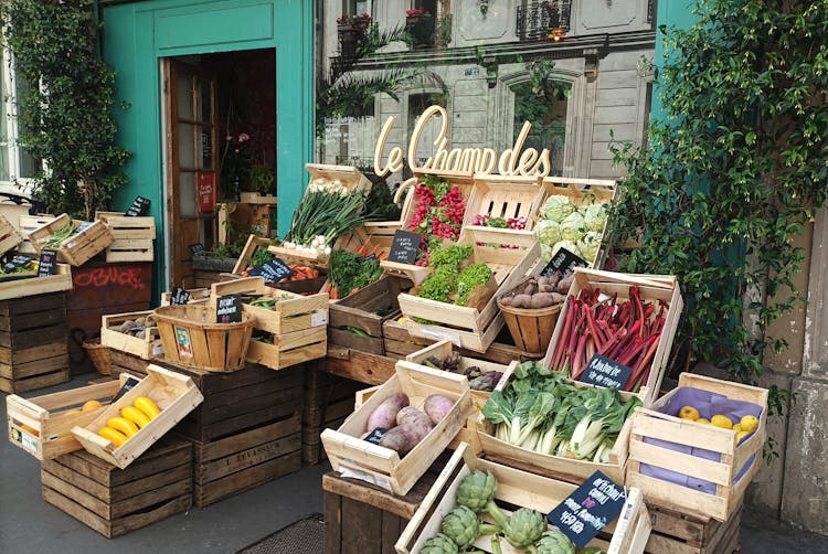 Fruits And Vegetables Displayed In Front Of A Grocery Store 