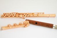 gold flute with wooden head