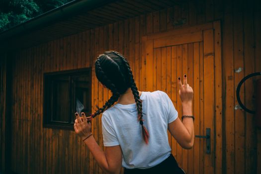 Woman Standing in Front of Brown Shed