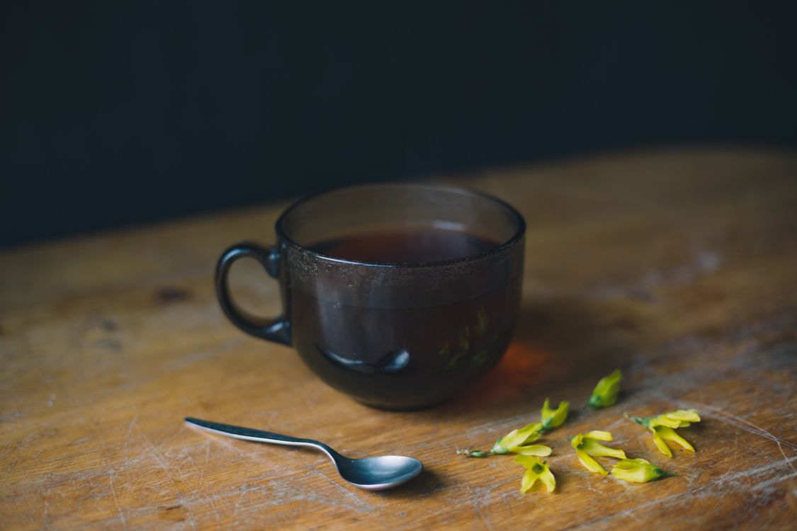 A Cup of Hot Tea on a Wooden Surface · Free Stock Photo