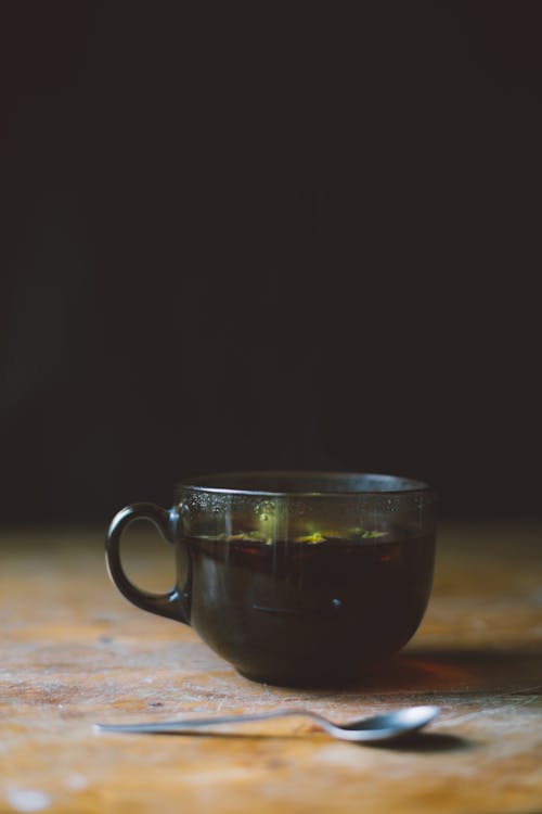 Free A Cup of Coffee on Wooden Table Stock Photo