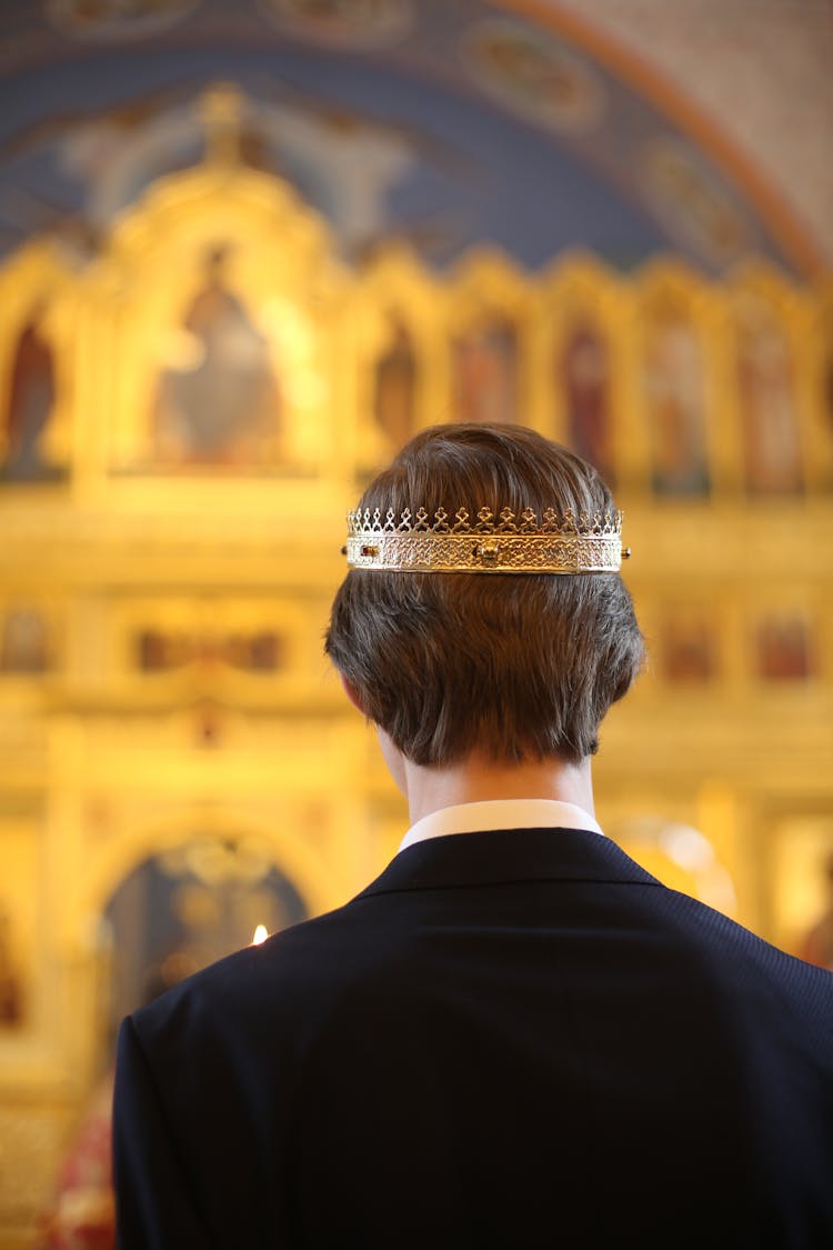 Back View Of Man Wearing Crown In Church