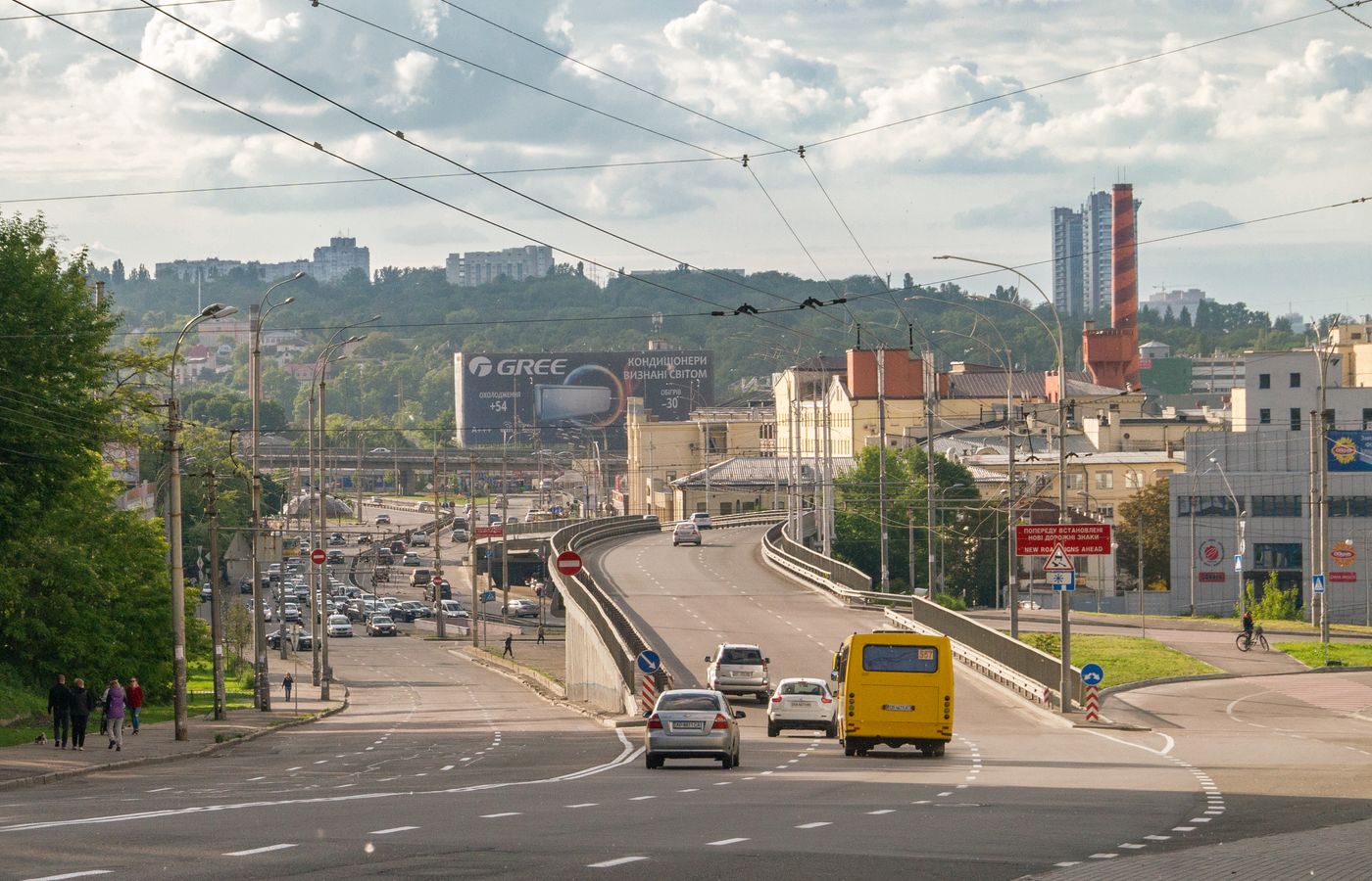View of urban traffic and architecture in downtown Kyiv, featuring roads and skyline.