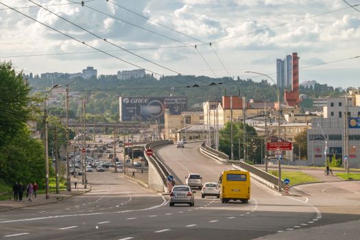 View of urban traffic and architecture in downtown Kyiv, featuring roads and skyline.