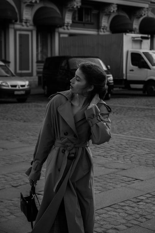Grayscale Photo of Woman Wearing Coat · Free Stock Photo