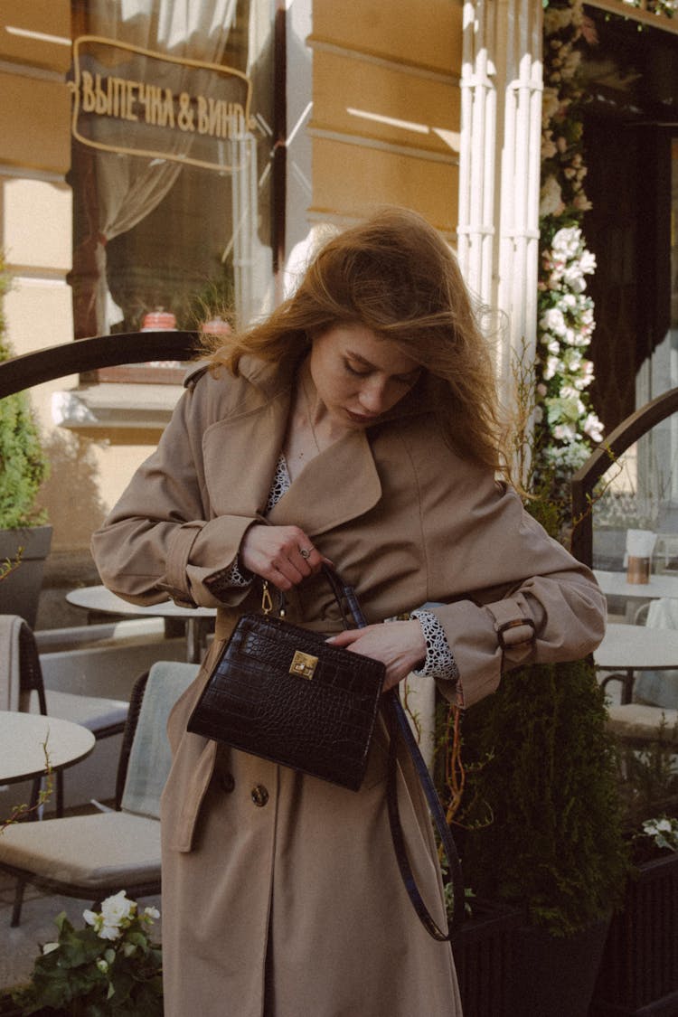 Woman Looking Into Bag