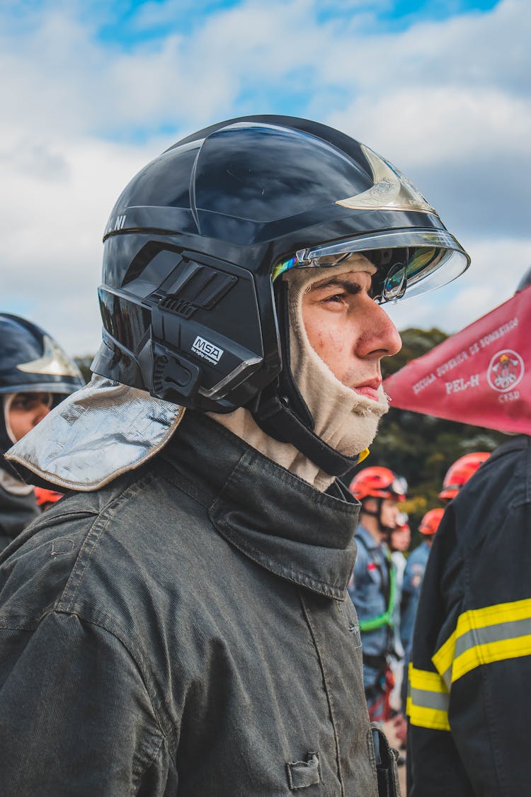 Firefighter In Protective Helmet