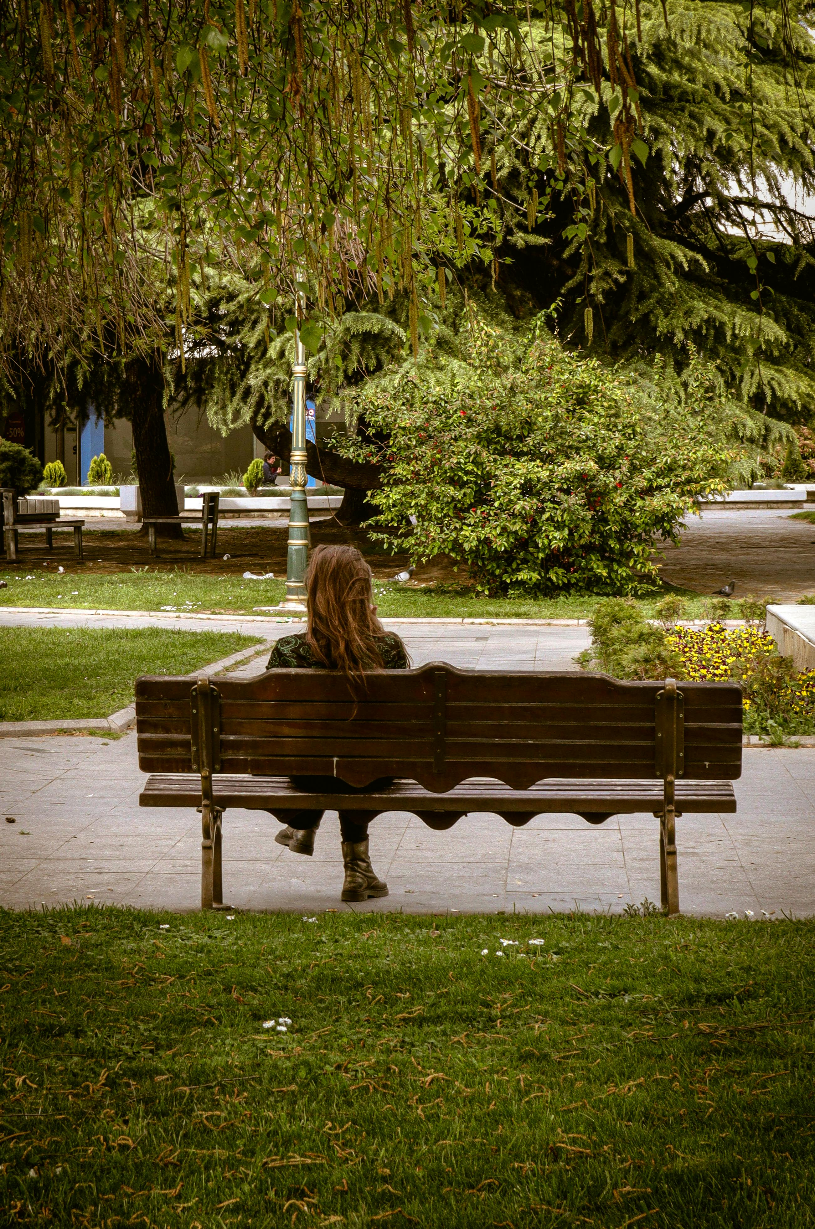 Girl Sitting Down On Bench