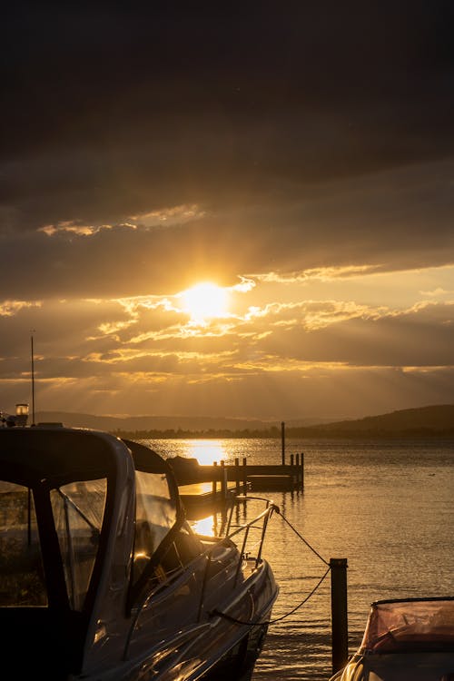 
A Boat Docked in a Marina during the Golden Hour