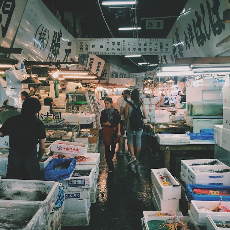 Free Person Waling on Market in Meat and Fish Section Stock Photo