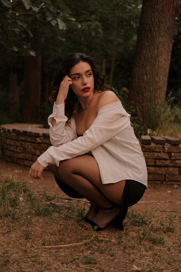 Woman In Shirt Crouching