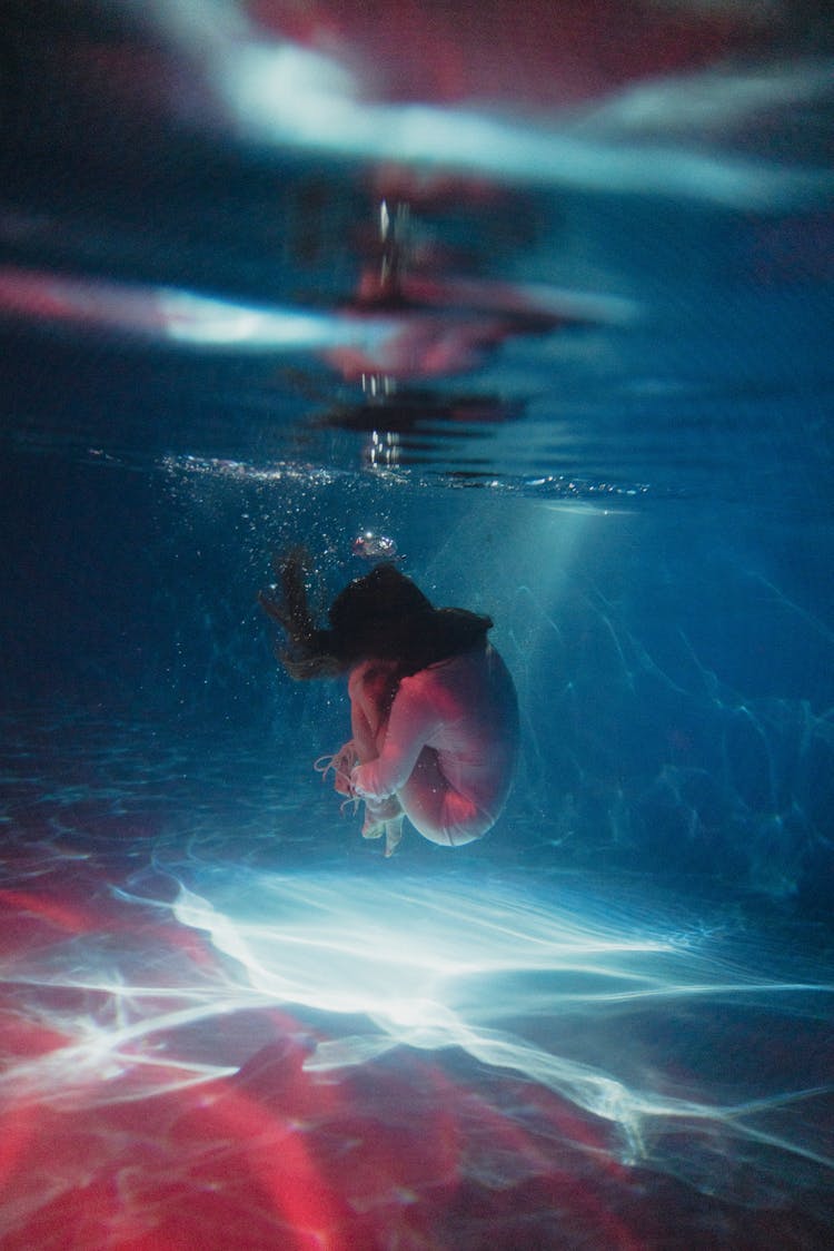 Woman Making Figure While Diving