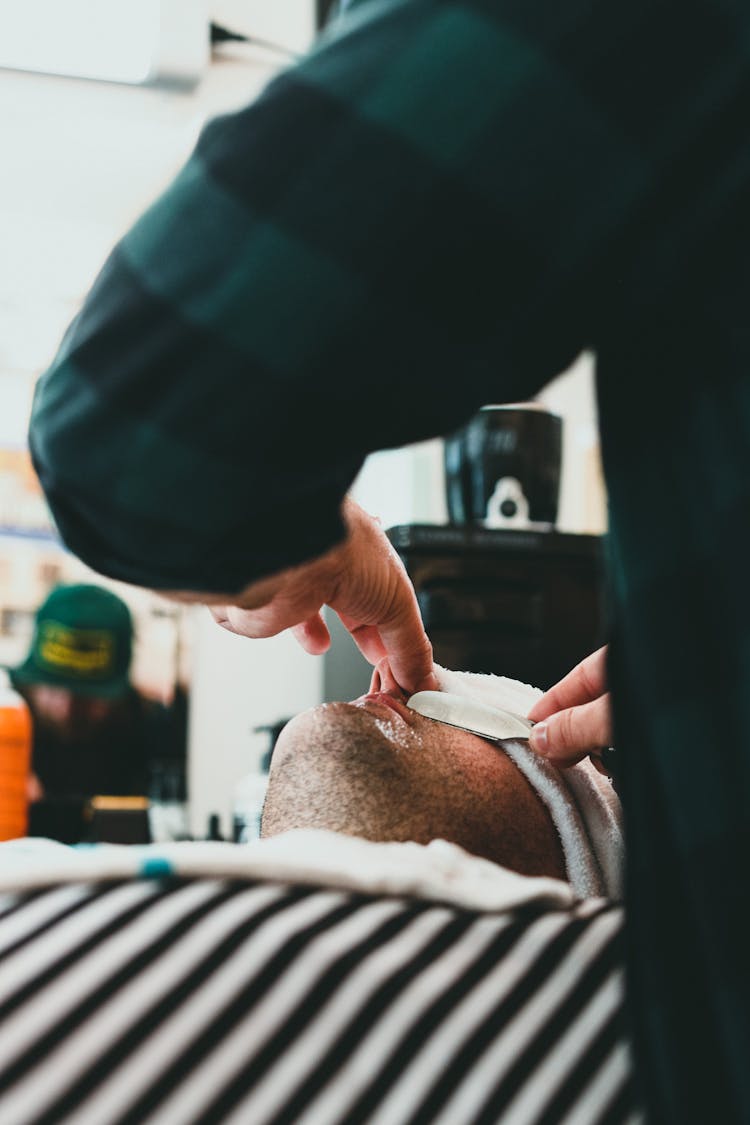 Barber Shaving His Client