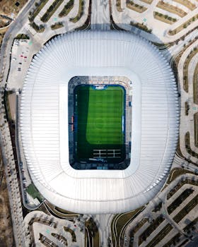 Drone shot of Estadio BBVA in Guadalupe, showcasing the stadium's unique architecture from above.