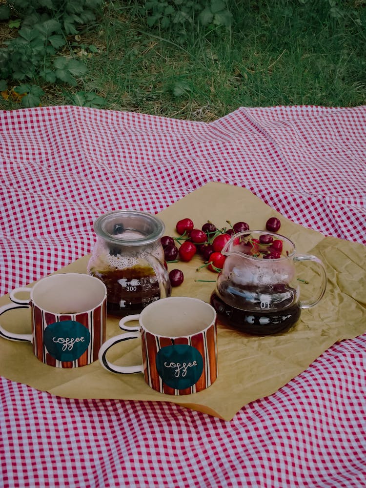 Pitchers, Fruit And Cups On Blanket