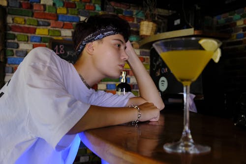 A Man Leaning on the Bar 