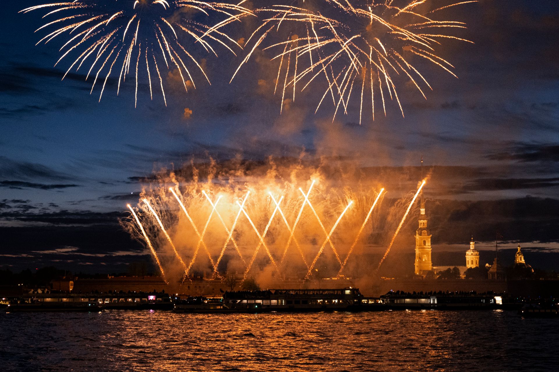 Dazzling fireworks light up the night sky above Peter and Paul Fortress in St. Petersburg, Russia.