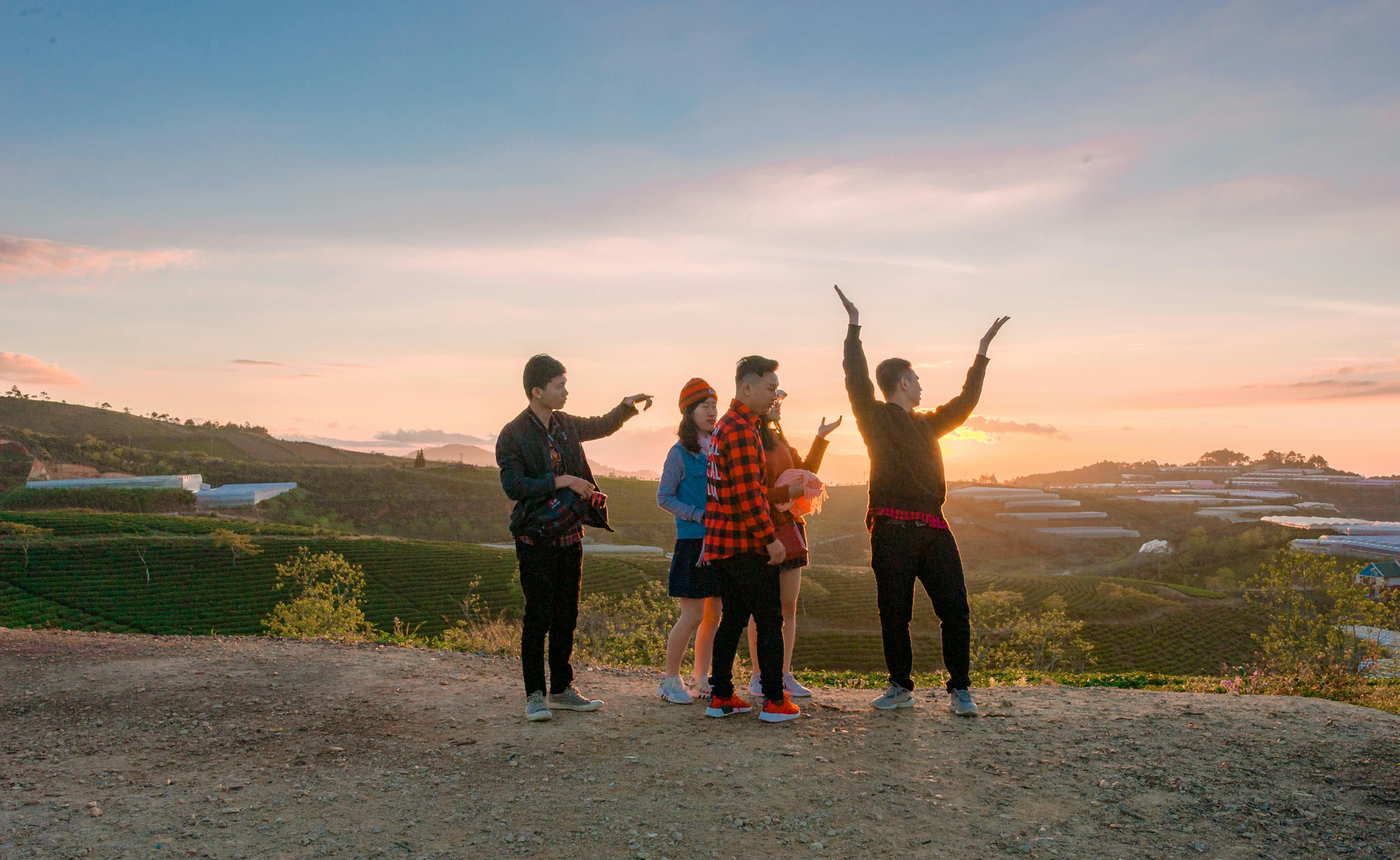 five person across sunset