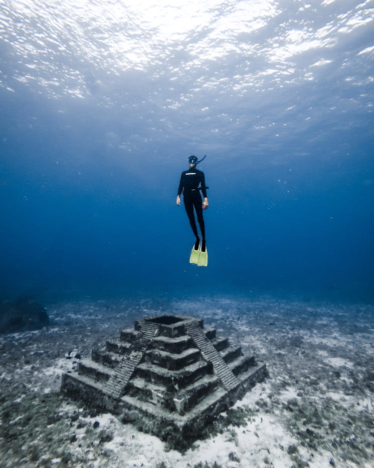 Underwater Shot Of A Diver And A Built Structure