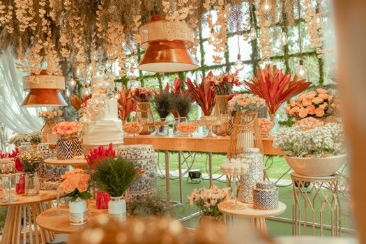 Exquisite indoor floral display with vibrant blooms and elegant decor, enhanced by warm lighting.