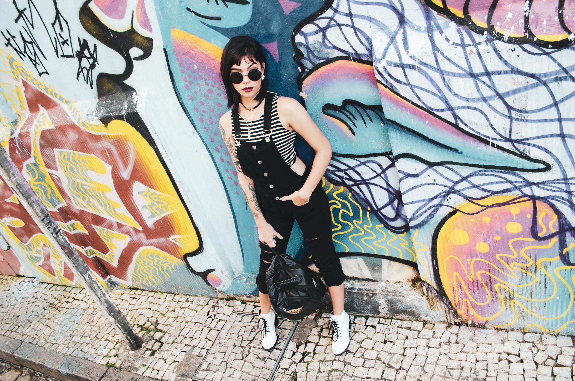 Woman Standing Near Wall With Graffiti