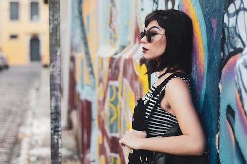 Free Woman Leaning on Wall Stock Photo