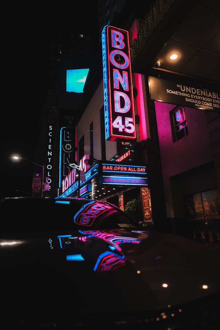 Car Parked Near Building With Neon Signages