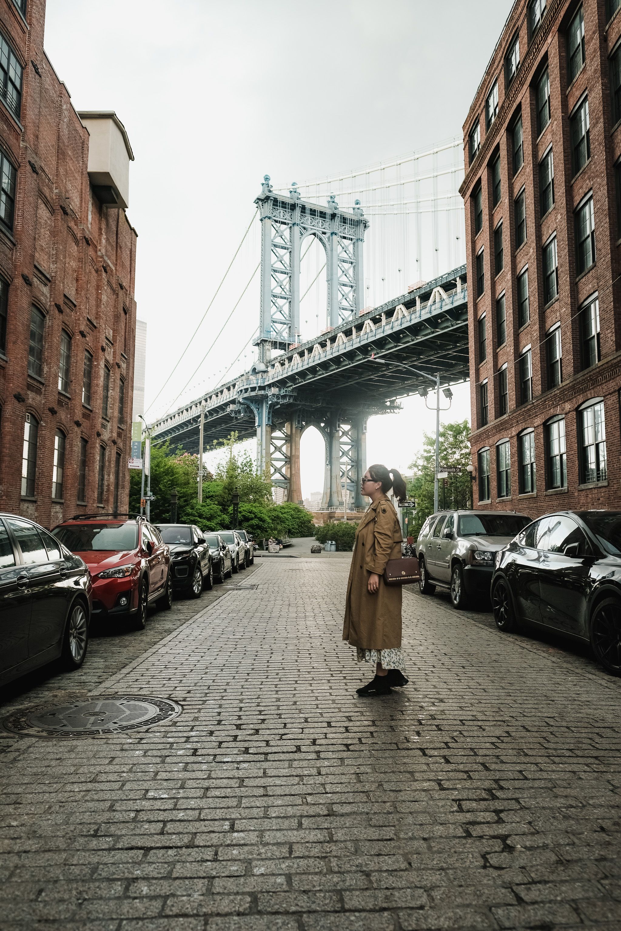 Woman in Brown Coat Standing on the Street · Free Stock Photo