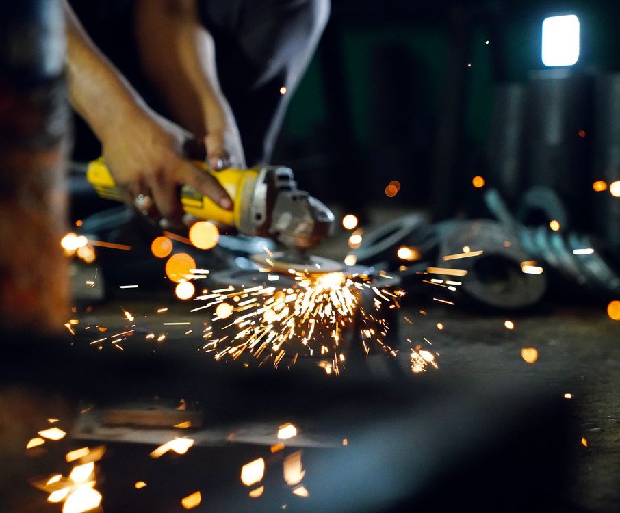 A Person Using a Grinder · Free Stock Photo