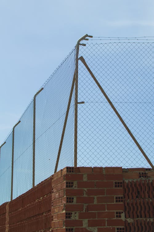 Metal Fence on Brick Wall