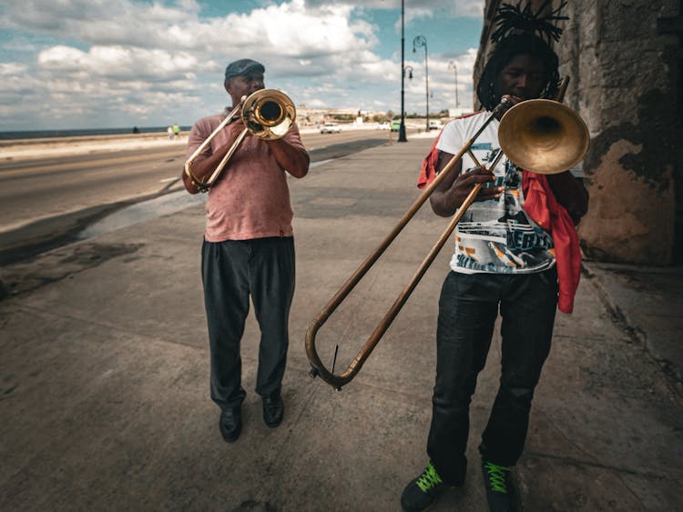 Men Playing Trumpets On The Street