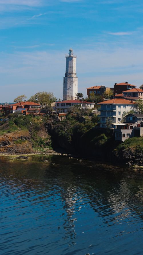 Free Beautiful view of Rumelifeneri Lighthouse on the coastline in Istanbul, Turkey, showcasing a serene blue sky. Stock Photo