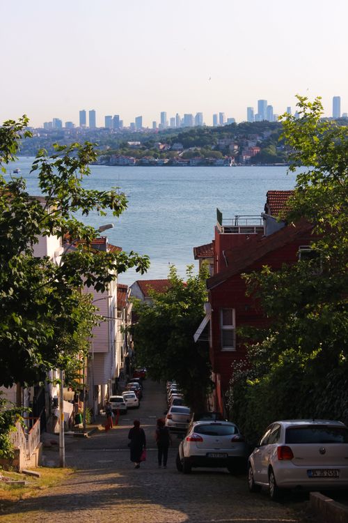 Free Charming Istanbul street with a view of the Bosphorus and modern skyline in the distance. Stock Photo
