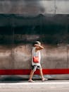 Man in Shorts with Handbag