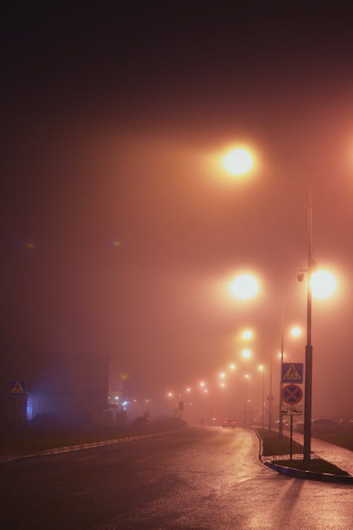 Road Lit up by Street Lights at Night