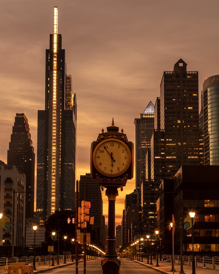 Clock On Street Of New York At Sunset