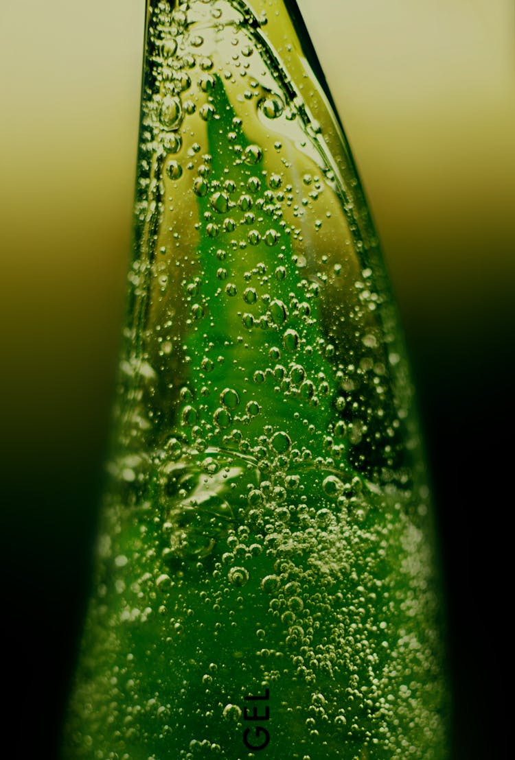 Macro Photography Of Aloe Vera Gel On A Plastic Container 