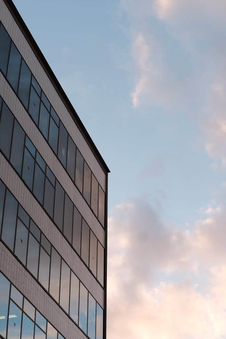 Modern Building With Windows On Sunset Sky