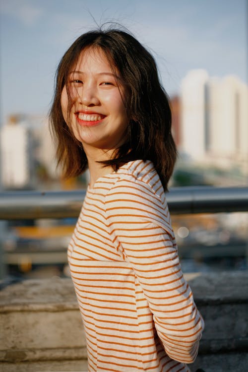 Portrait of Happy Woman on City Street