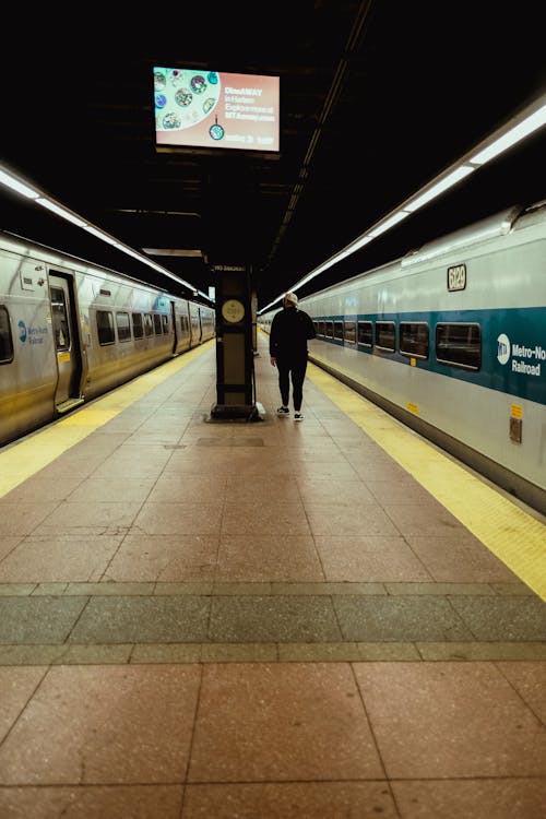 A Man Walking at the Subway Station