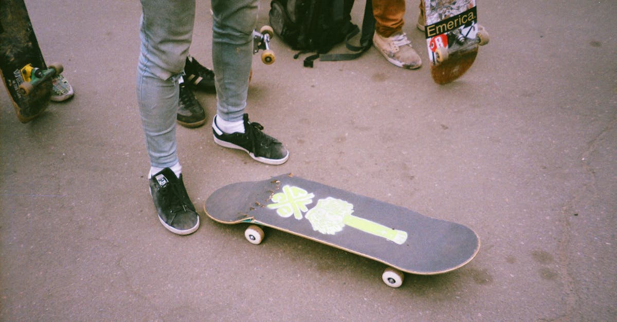 Person Standing Beside Broken Skateboard